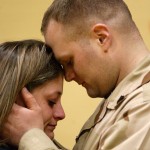 Marine comforts girlfriend.